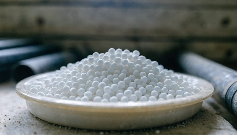 White urea prills in a plain dish.