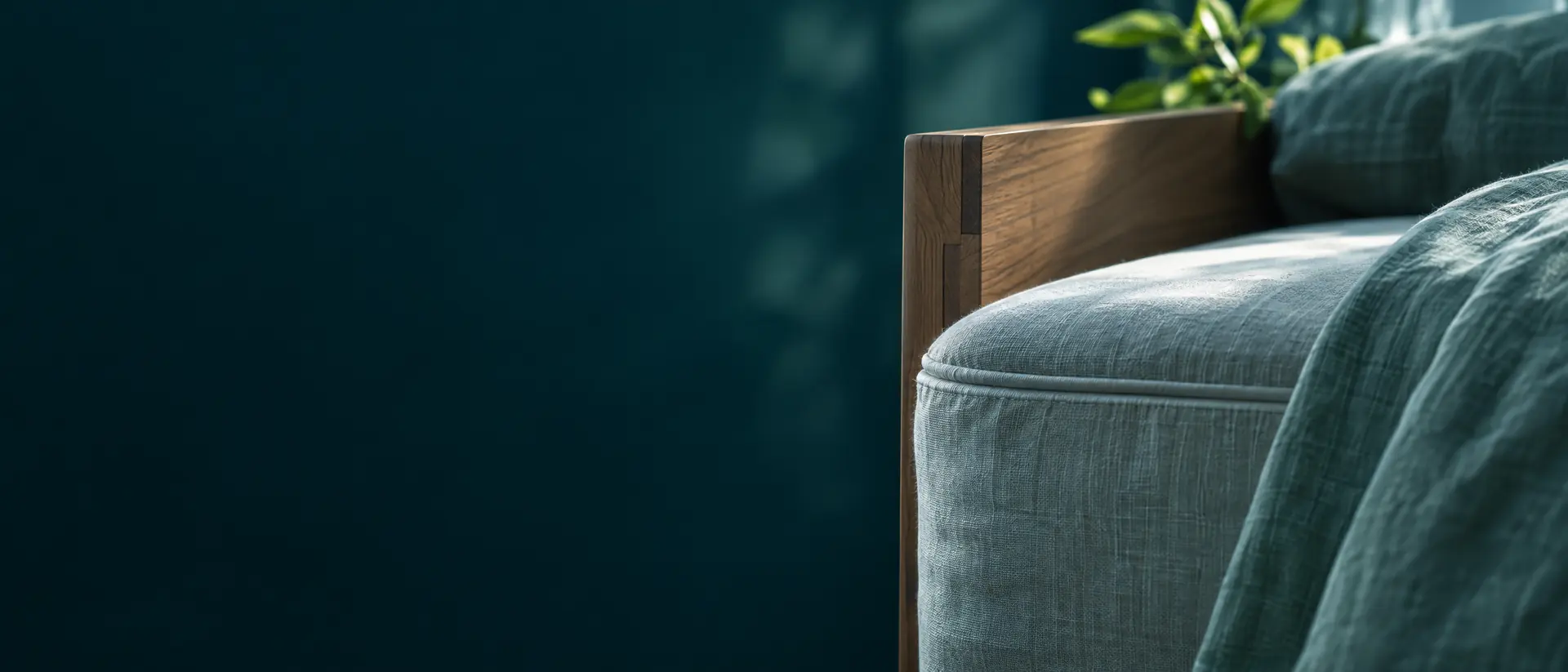 Mattress seam and wooden headboard joint in soft window light