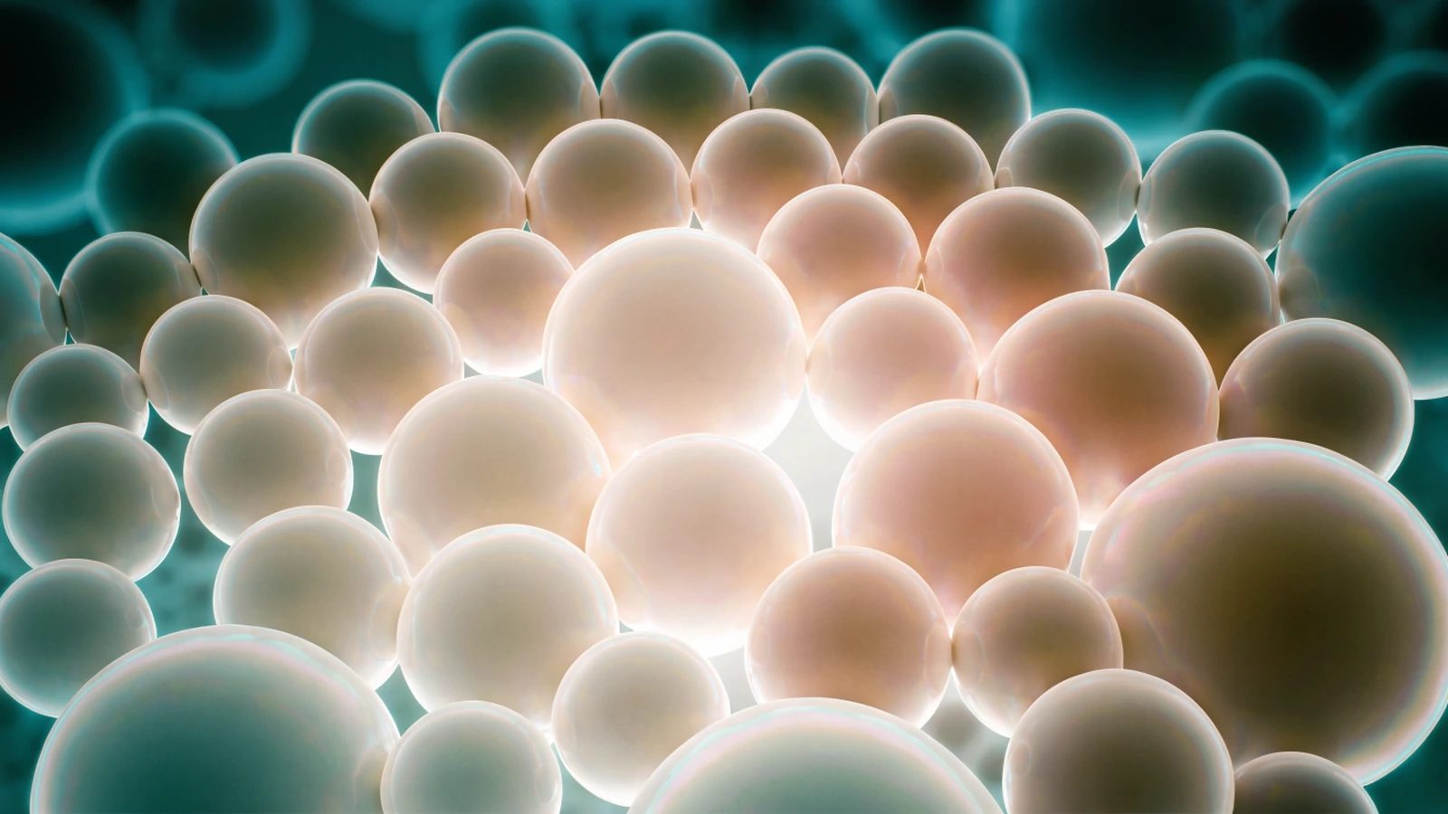 A decorative microscopic-texture image showing closely packed smooth spheres.